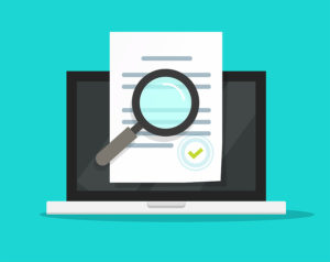 Clipart of a laptop with a document in front of it, being inspected by a magnifying glass